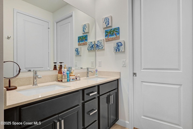 full bathroom featuring double vanity and a sink