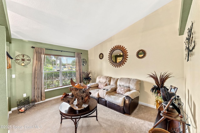 living room with light carpet, vaulted ceiling, and baseboards