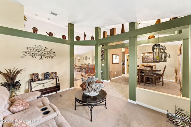 living room featuring carpet, a notable chandelier, visible vents, vaulted ceiling, and tile patterned floors