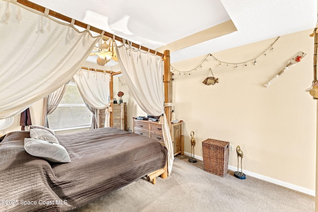 bedroom with baseboards and carpet flooring