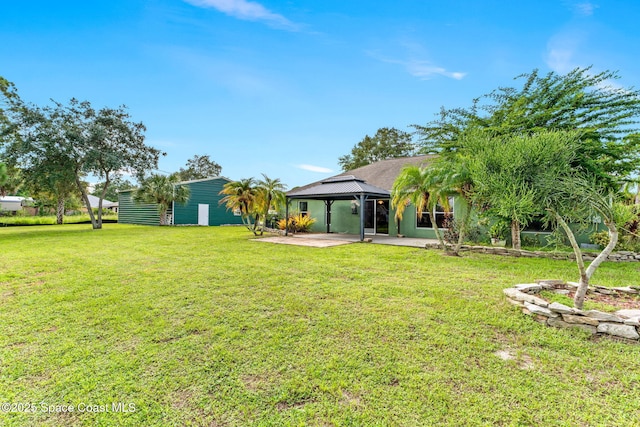 view of yard featuring a patio area and a gazebo