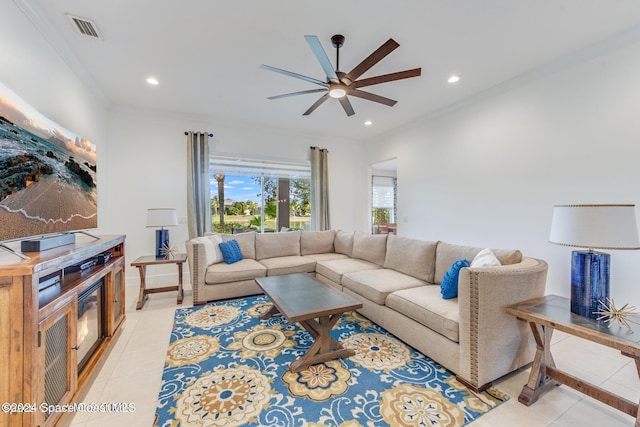 living room with recessed lighting, crown molding, and light tile patterned floors