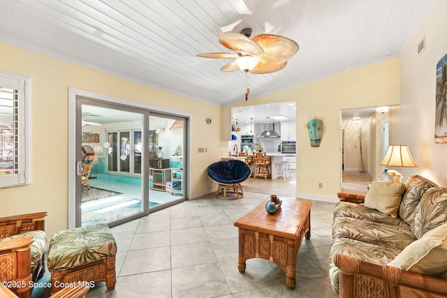 living room with light tile patterned floors, visible vents, ceiling fan, and a healthy amount of sunlight