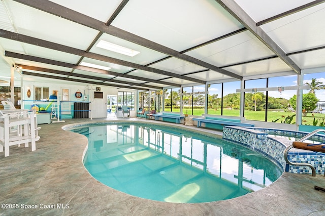 view of pool with a pool with connected hot tub
