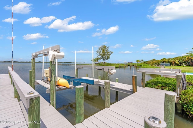 view of dock with a water view and boat lift