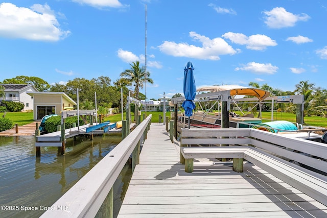 view of dock with a water view and boat lift
