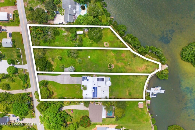 drone / aerial view with a water view