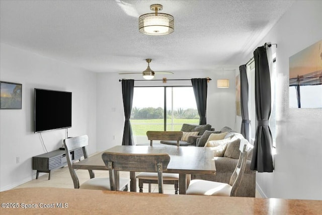 dining space with a textured ceiling