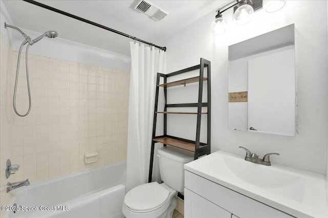 bathroom featuring toilet, vanity, visible vents, and shower / bathtub combination with curtain