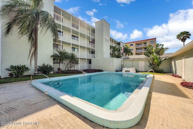 pool featuring a patio area