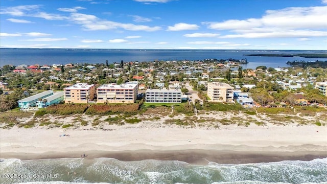 aerial view featuring a water view and a beach view