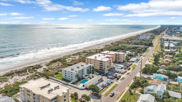 birds eye view of property featuring a water view and a view of the beach