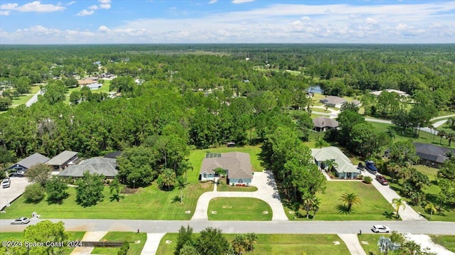 aerial view with a residential view and a wooded view