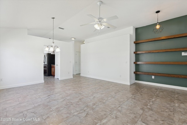 interior space featuring ceiling fan, lofted ceiling, visible vents, and baseboards