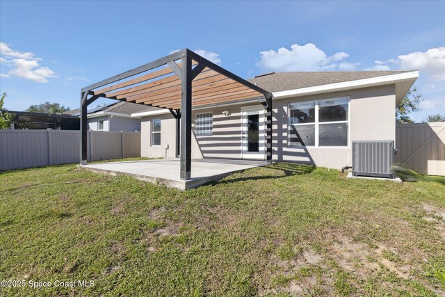 rear view of property featuring a pergola, a yard, a patio area, central AC, and stucco siding