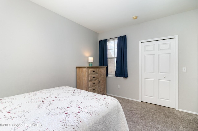 carpeted bedroom with vaulted ceiling and baseboards