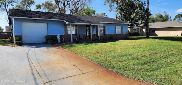 ranch-style home featuring a garage, brick siding, concrete driveway, a front lawn, and stucco siding