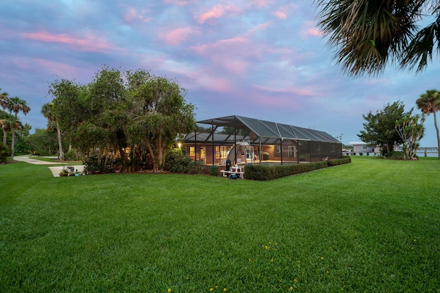 yard at dusk with glass enclosure