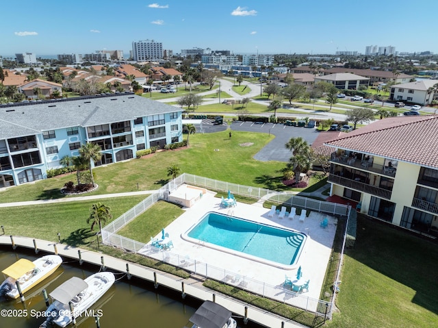 drone / aerial view featuring a water view and a city view