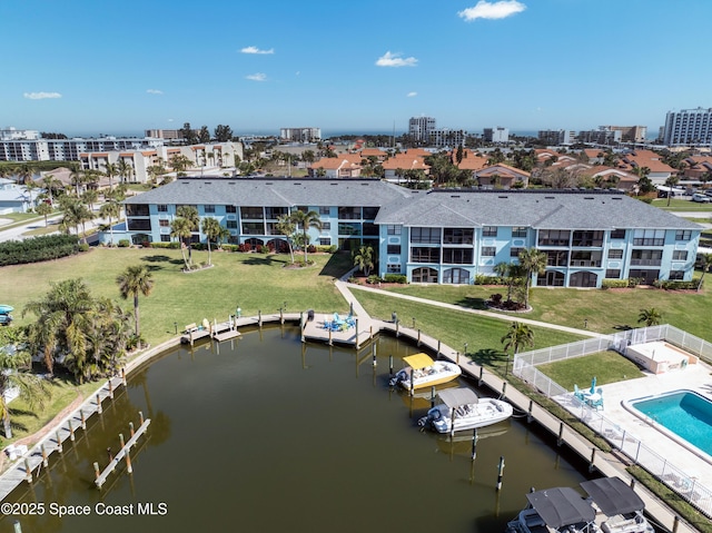 birds eye view of property featuring a water view