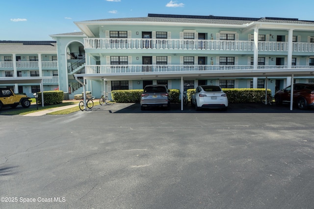 view of building exterior with covered parking