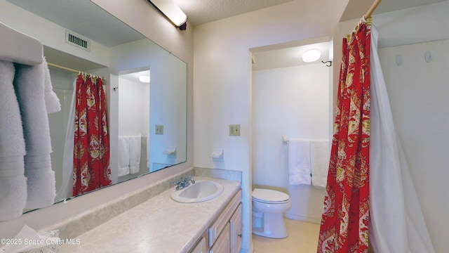 bathroom with visible vents, a shower with shower curtain, toilet, a textured ceiling, and vanity