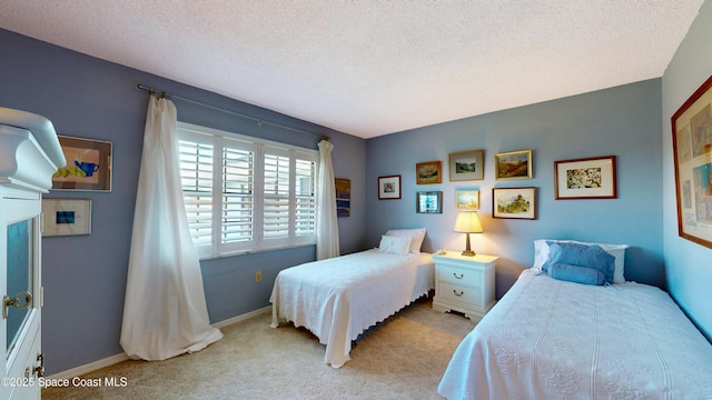 1999 S Banana River Blvd Unit 313, Cocoa Beach, FL 32931 - bedroom with carpet, a textured ceiling, and baseboards