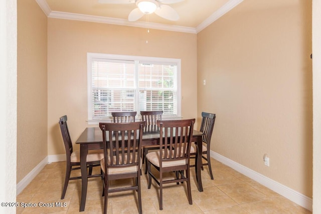 dining room with light tile patterned floors, baseboards, and crown molding