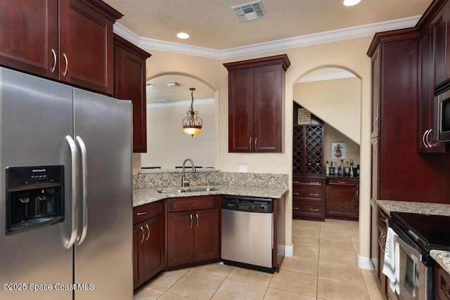 kitchen with light stone counters, light tile patterned floors, visible vents, appliances with stainless steel finishes, and a sink