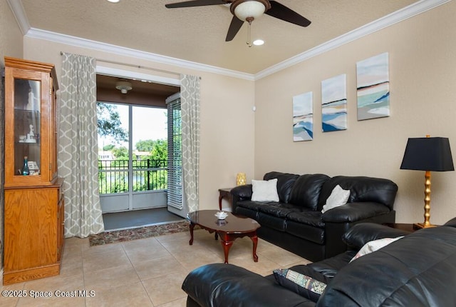 living room with light tile patterned floors, ornamental molding, and a textured ceiling