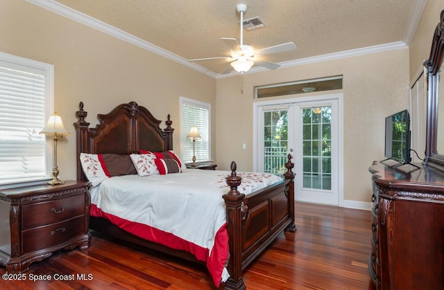 bedroom with dark wood-style floors, access to outside, visible vents, and crown molding