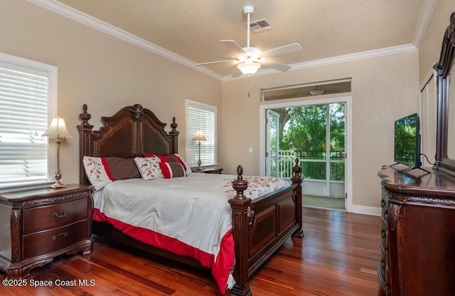 bedroom with ornamental molding, dark wood finished floors, visible vents, and access to exterior