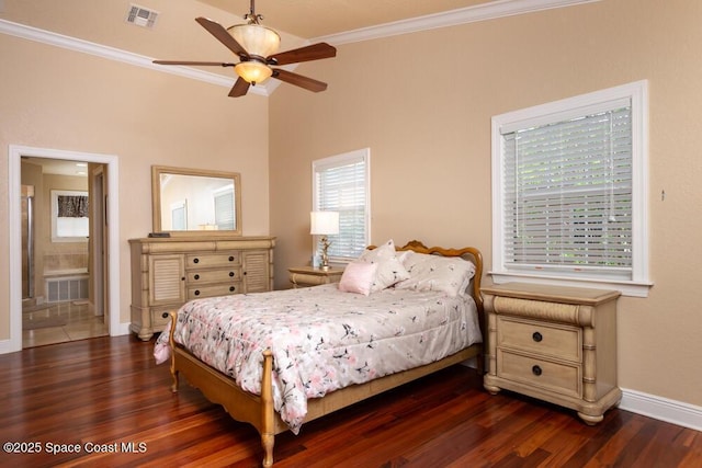 bedroom featuring dark wood finished floors, visible vents, and crown molding