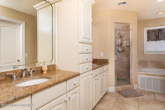 bathroom with two vanities, visible vents, a sink, and a shower stall