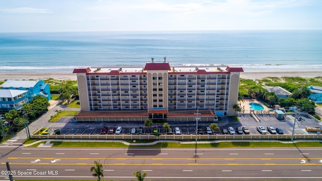 bird's eye view with a beach view and a water view