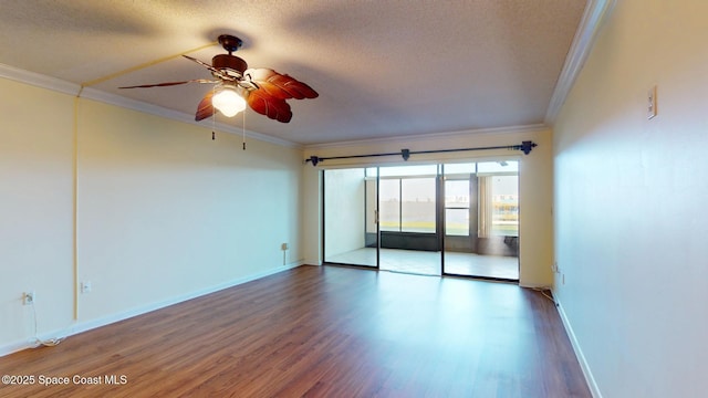 unfurnished room featuring baseboards, a textured ceiling, ornamental molding, and wood finished floors