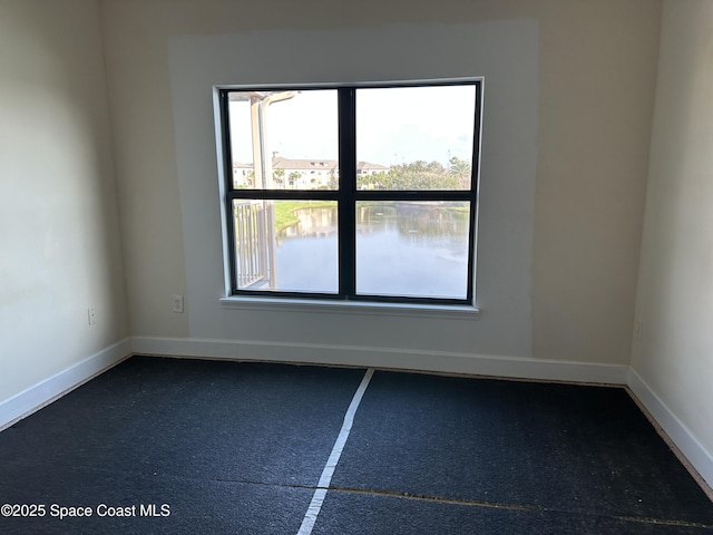 empty room with baseboards