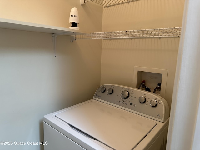 washroom with laundry area and washer / clothes dryer