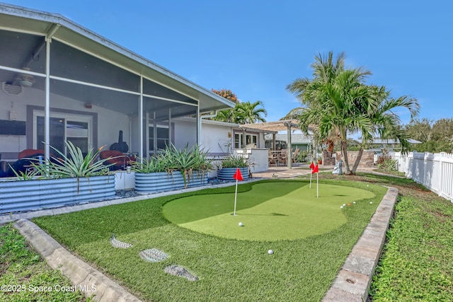 view of yard with a pergola, fence, a patio, and a sunroom