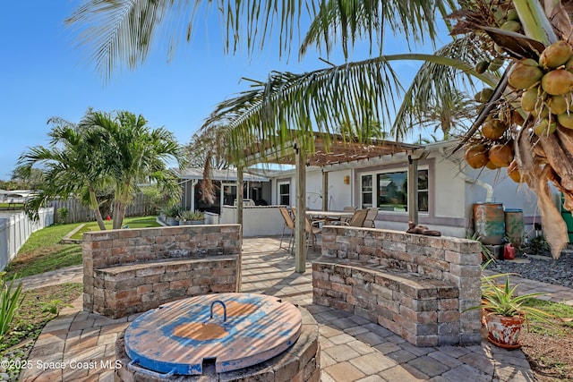 view of patio featuring area for grilling, a fenced backyard, and a pergola