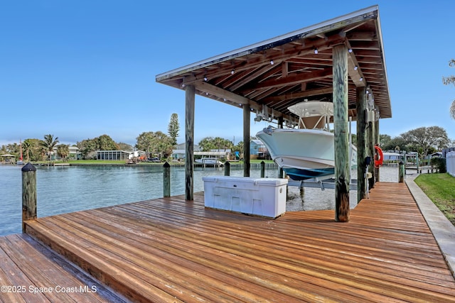 view of dock featuring a water view and boat lift