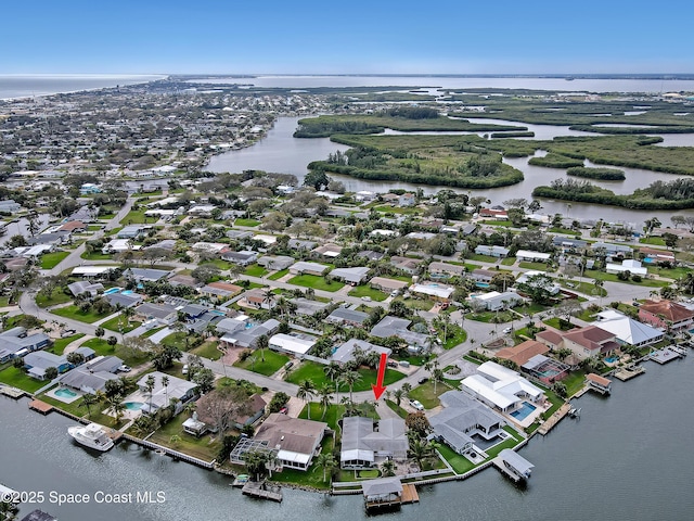 aerial view with a water view and a residential view