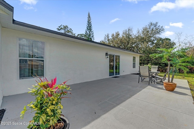 view of patio featuring outdoor dining area