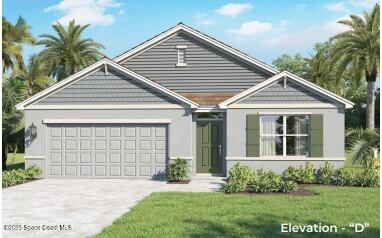 view of front of property featuring driveway, a front lawn, and an attached garage