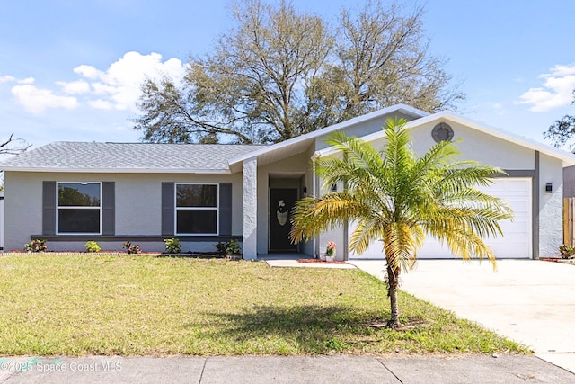 view of front of house with a garage, a front yard, concrete driveway, and stucco siding