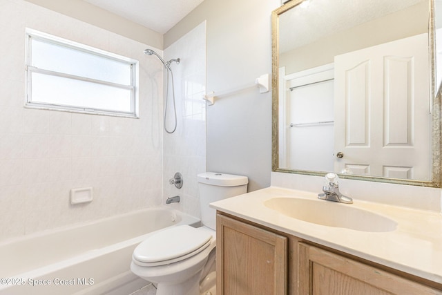 full bath with toilet, vanity, and bathing tub / shower combination