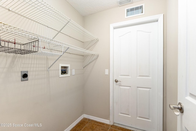 laundry room featuring washer hookup, visible vents, hookup for an electric dryer, tile patterned flooring, and laundry area