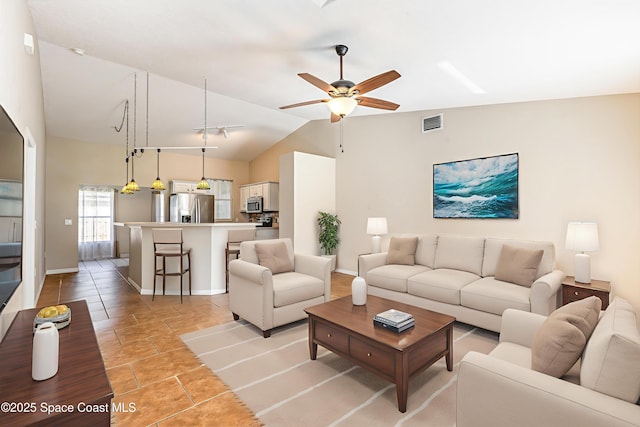 6480 Annapolis St, Cocoa, FL 32927 - living room with vaulted ceiling and ceiling fan