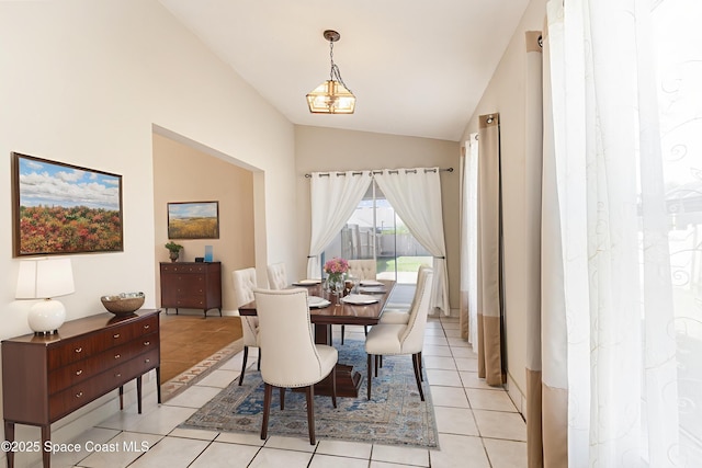 6480 Annapolis St, Cocoa, FL 32927 - dining space with vaulted ceiling and light tile patterned floors