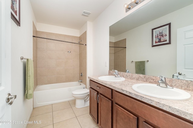 bathroom with double vanity, shower / bath combination, tile patterned flooring, and a sink